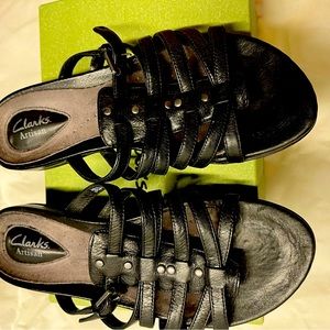 Clark black straps sandals. Slight wedge heel. Barely worn.